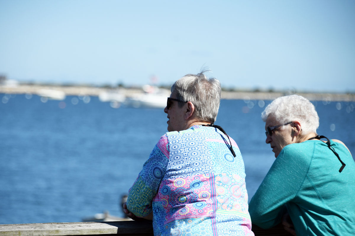 044 Marge Bredow and Joyce Hamling enjoyed the cool breeze of the Atlantic Ocean during a lunch stop at Plymouth Harbor.jpg